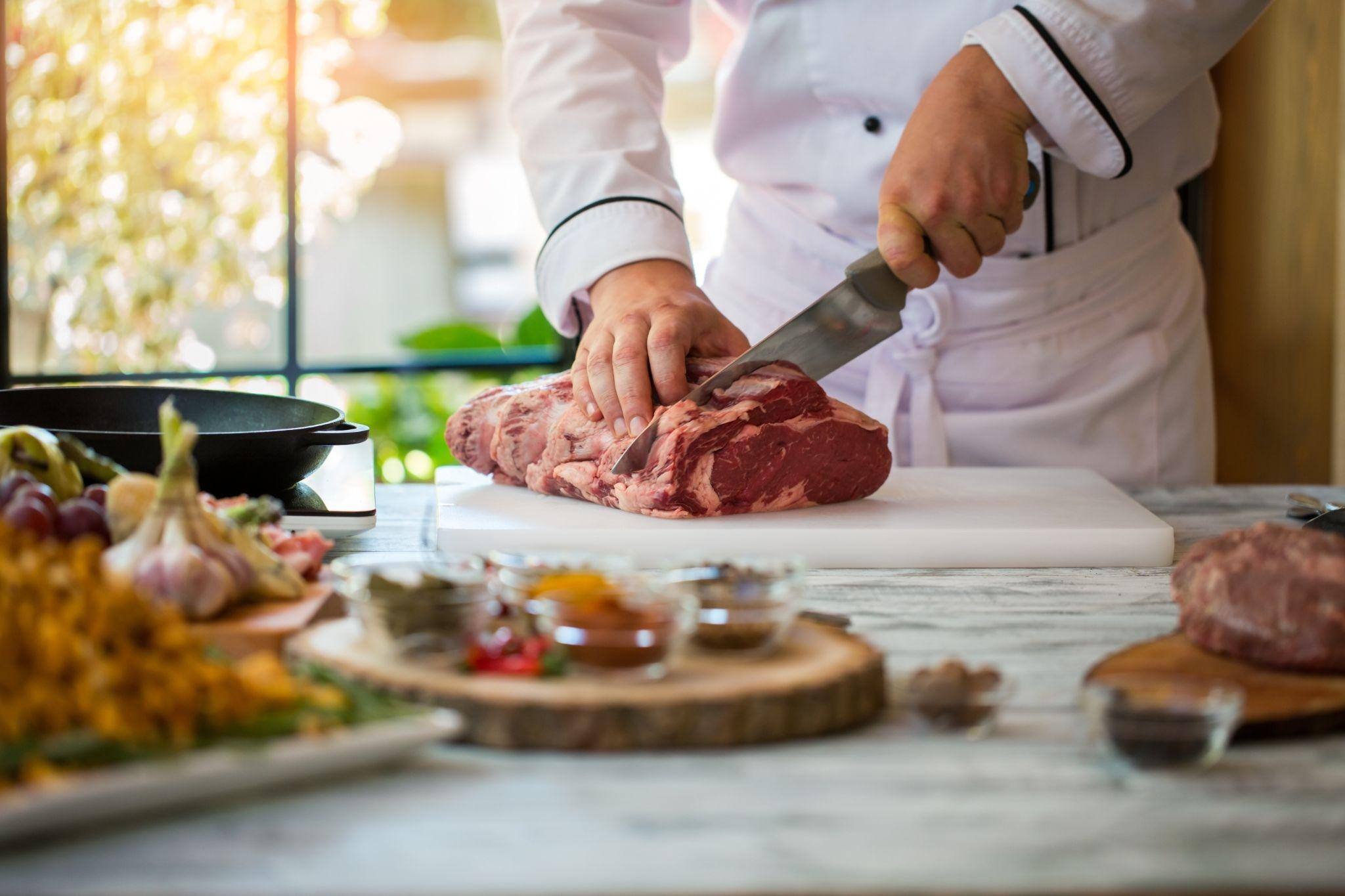 hand-with-knife-cuts-meat